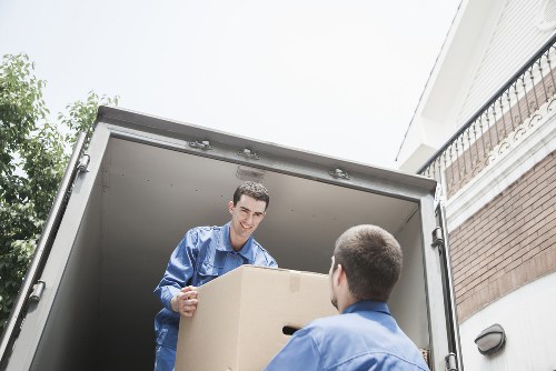 Worker wearing PPE handling household waste